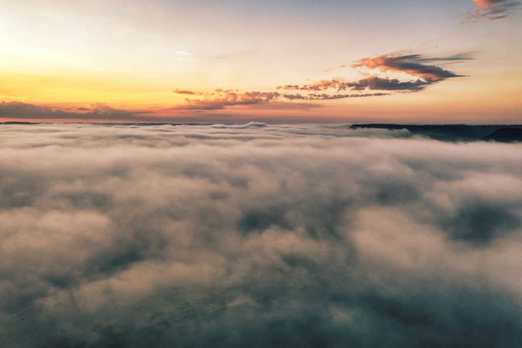 A breathtaking view of a dramatic cloudscape above Weaver, Minnesota during sunset, capturing the serenity and beauty of nature.